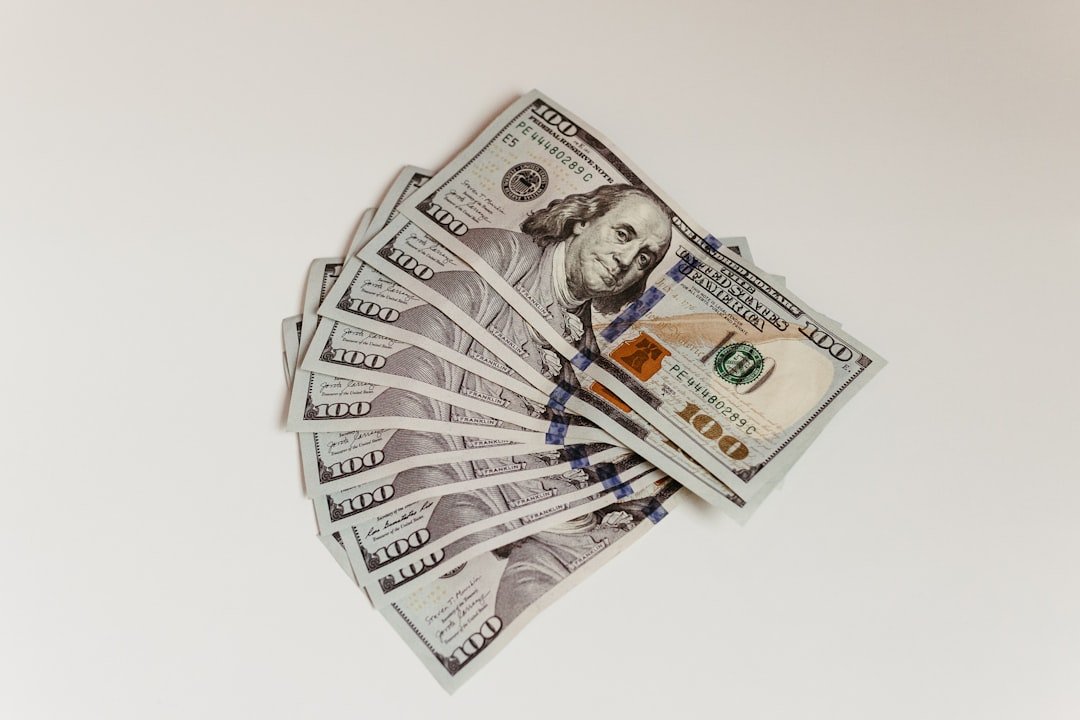 a stack of twenty dollar bills sitting on top of each other