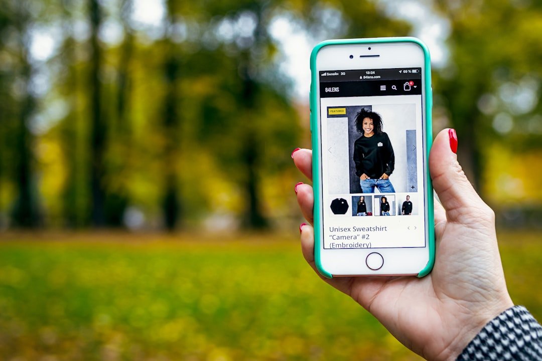 woman in black sweater in iPhone display