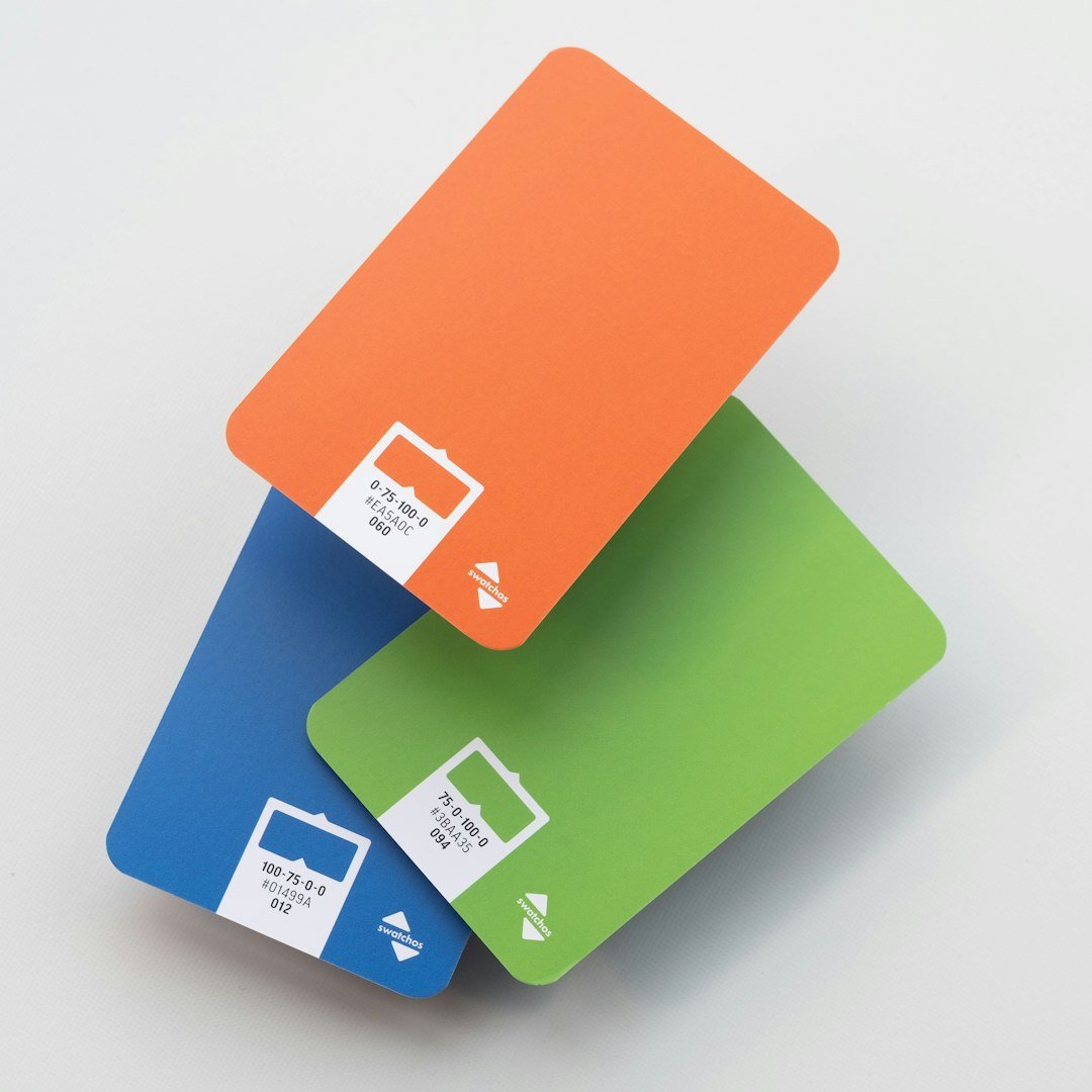 three credit cards stacked on top of each other