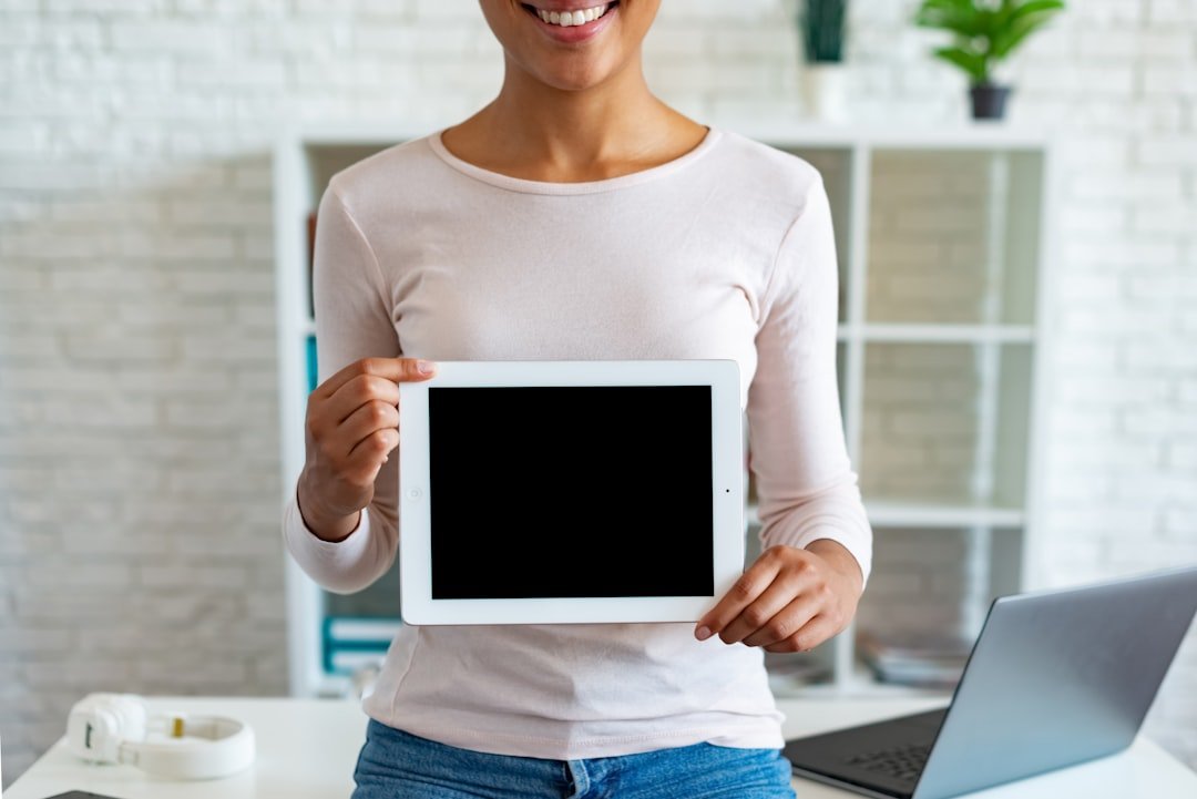 a person holding a laptop