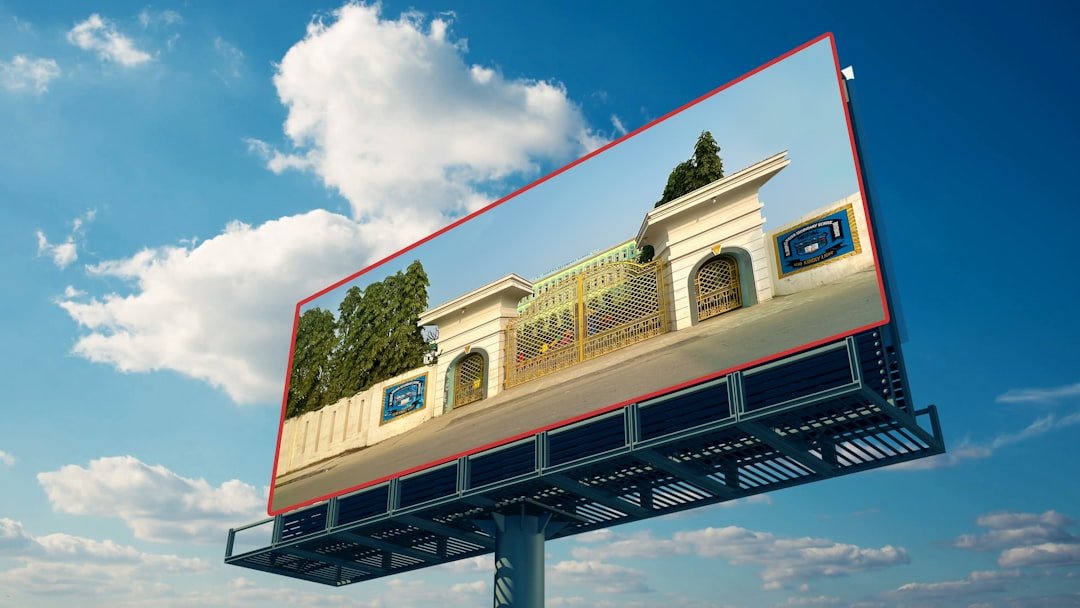A billboard with a picture of a building on it