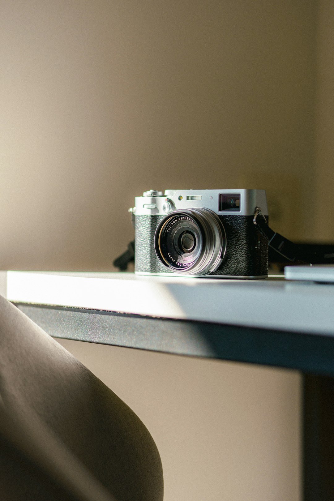 a camera sitting on top of a table next to a window
