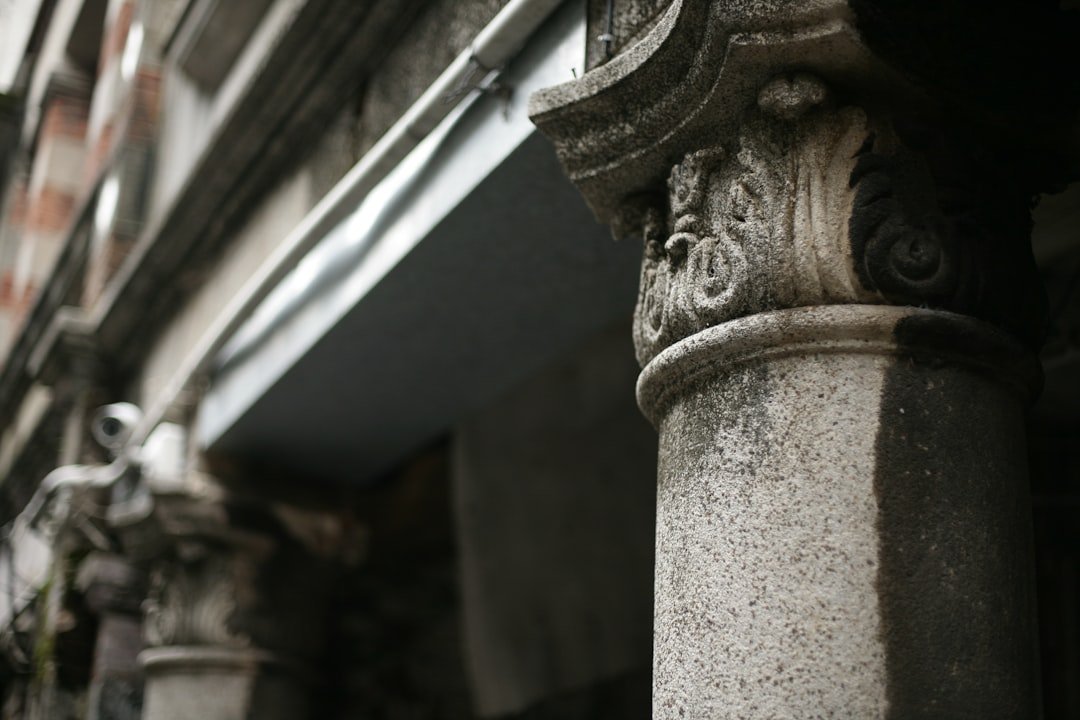 Architectural details of ancient stone pillars are visible.