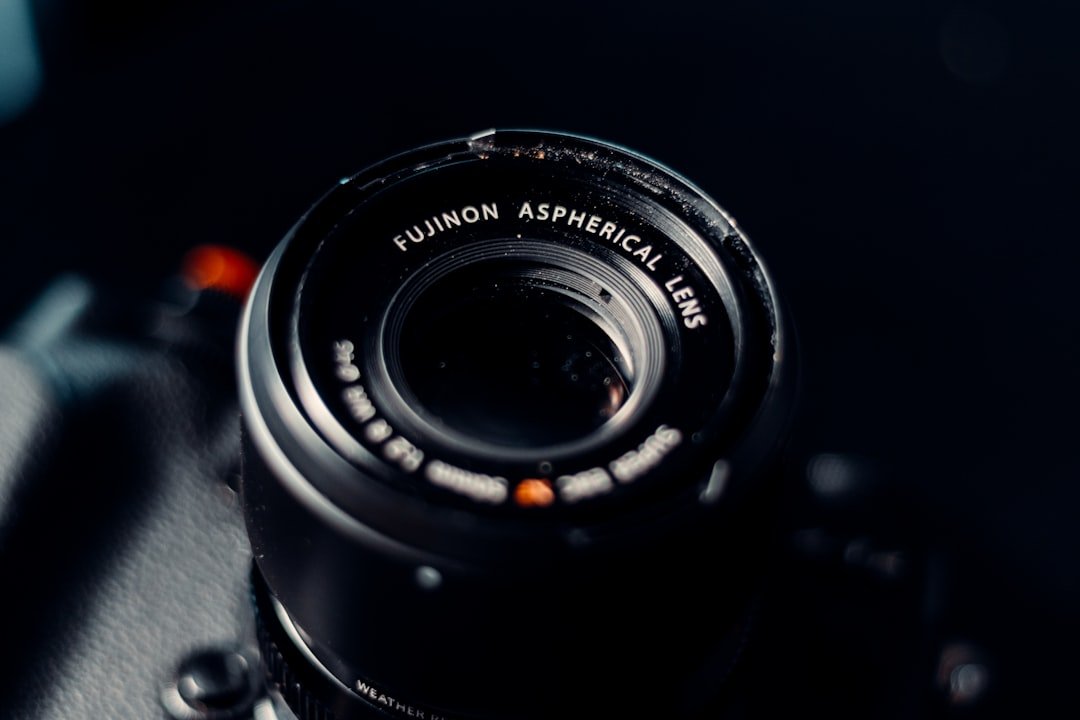 black camera lens on black surface