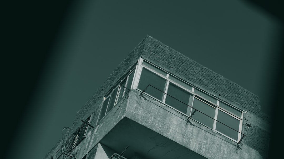 a black and white photo of a tall building