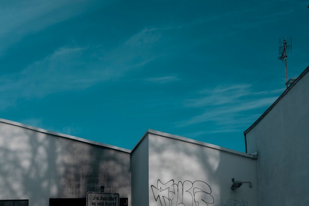 white and blue concrete building under blue sky during daytime