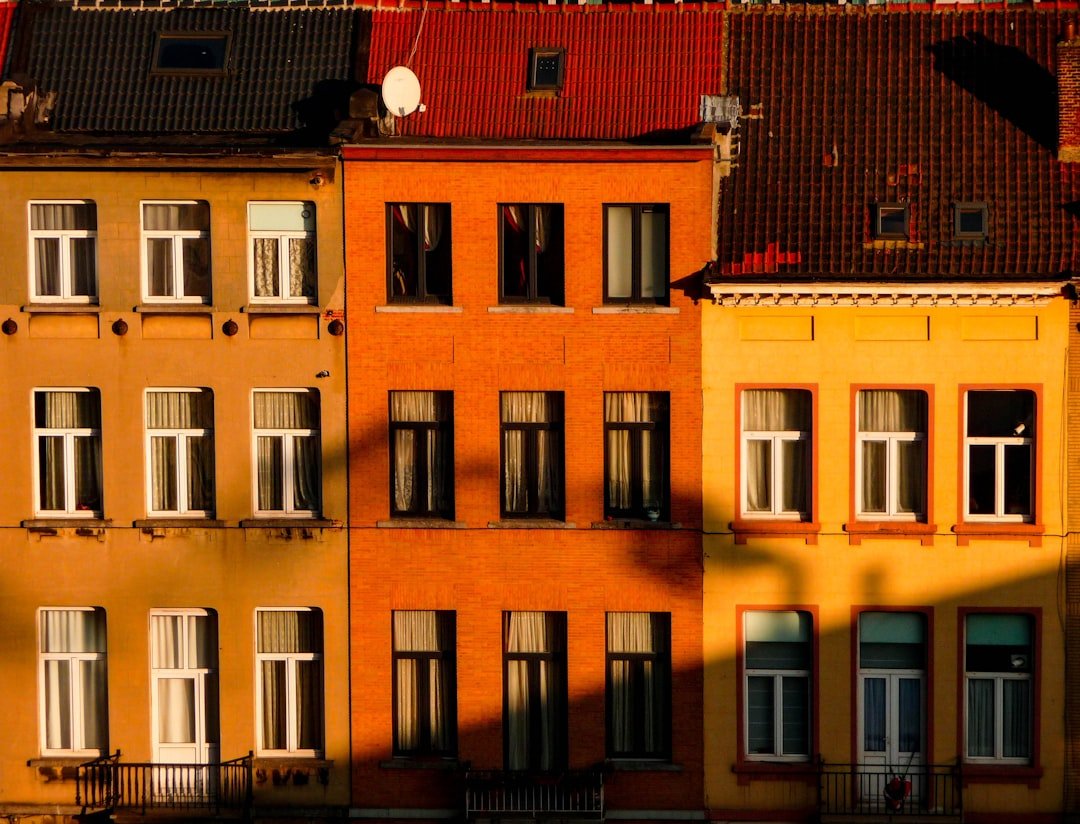 a row of buildings with windows and balconies