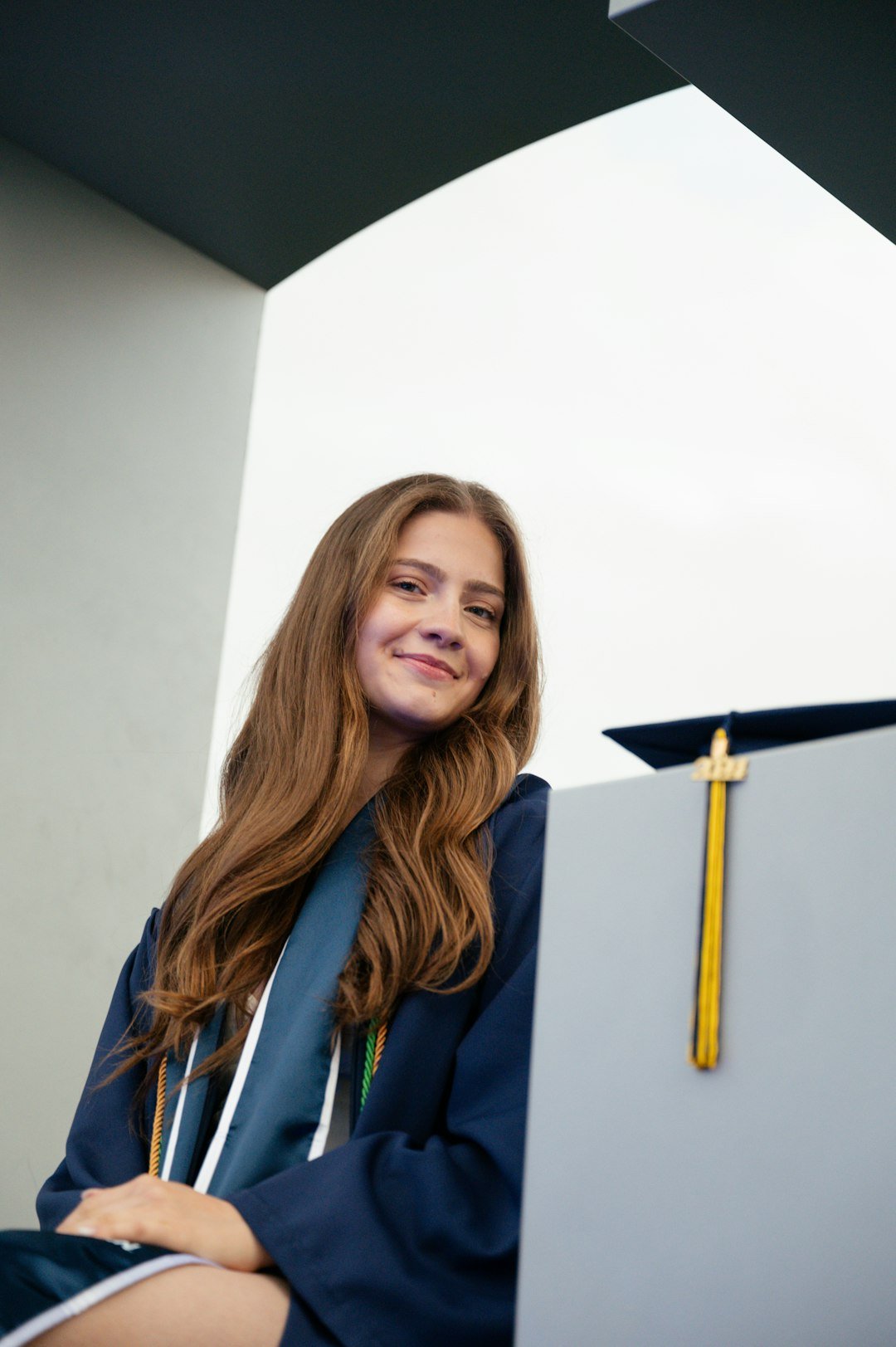 a woman in a graduation cap and gown
