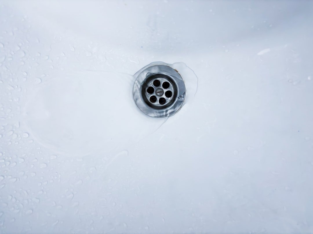 Water drains into a sink.