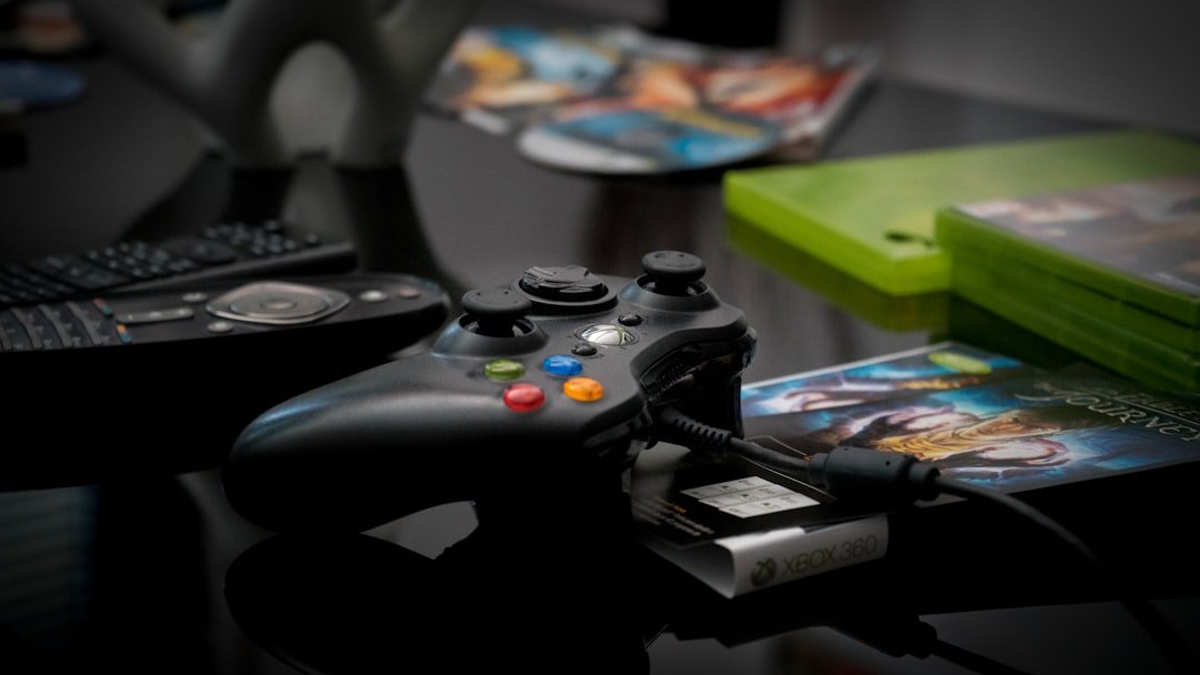 black Microsoft Xbox 360 controller
