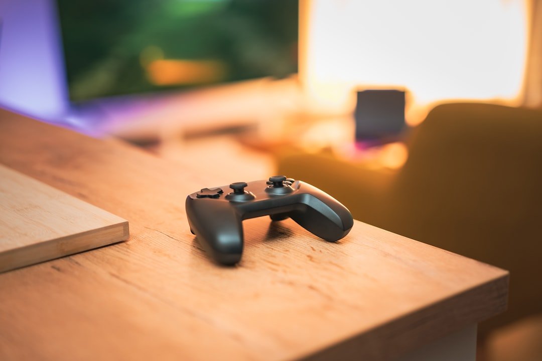 A close up of a video game controller on a table